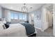 Main bedroom with large windows offering scenic views and an ensuite bathroom at 84 Via Franello, Henderson, NV 89011