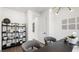 Bright home office featuring a dark desk, modern shelving, and contemporary decor at 84 Via Franello, Henderson, NV 89011