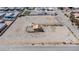 Expansive aerial view of a home and lot featuring a desert landscape and charming perimeter fence at 8430 Gagnier Blvd, Las Vegas, NV 89113