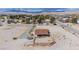 Wide aerial view of a property featuring a landscape and a compact residence with a rustic fence at 8430 Gagnier Blvd, Las Vegas, NV 89113