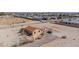Aerial view of a property within a residential area, displaying a house with a metal roof at 8430 Gagnier Blvd, Las Vegas, NV 89113