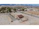 A cozy desert home features a charming porch and a well-maintained gravel driveway at 8430 Gagnier Blvd, Las Vegas, NV 89113