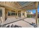 Covered back patio with a ceiling fan and view of the landscaped backyard at 8840 Arroyo Azul St, Las Vegas, NV 89131