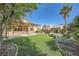Large landscaped backyard and a covered patio perfect for outdoor entertaining at 8840 Arroyo Azul St, Las Vegas, NV 89131