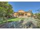 Expansive backyard showcasing the landscaped yard and covered patio, perfect for relaxing at 8840 Arroyo Azul St, Las Vegas, NV 89131
