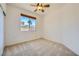 Clean bedroom featuring a large window offering a view of palm trees at 8840 Arroyo Azul St, Las Vegas, NV 89131