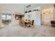 Cozy dining area with carpet, open to kitchen with a pass through at 8840 Arroyo Azul St, Las Vegas, NV 89131