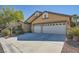 Charming home featuring a spacious two-car garage and well-maintained landscaping at 8840 Arroyo Azul St, Las Vegas, NV 89131