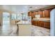 Spacious kitchen featuring granite countertops, wooden cabinetry, and an open layout at 8840 Arroyo Azul St, Las Vegas, NV 89131