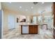 Bright and airy kitchen with granite counters, a central island, and modern appliances at 8840 Arroyo Azul St, Las Vegas, NV 89131