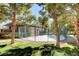 Community basketball court with green chain-link fencing, nestled among trees and lawns at 9050 W Warm Springs Rd # 1074, Las Vegas, NV 89148