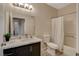 Bathroom featuring marble countertop vanity and shower-tub combo with curtain at 9050 W Warm Springs Rd # 1074, Las Vegas, NV 89148