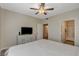 Bedroom featuring dresser with TV and access to a well-lit bathroom at 9050 W Warm Springs Rd # 1074, Las Vegas, NV 89148