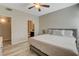 Bright, neutral bedroom featuring bedside table and access to bathroom and closet at 9050 W Warm Springs Rd # 1074, Las Vegas, NV 89148