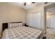 Bedroom features a cozy queen bed and a spacious sliding-door closet at 9050 W Warm Springs Rd # 1074, Las Vegas, NV 89148