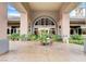 Elegant clubhouse entrance with arched windows, lush plantings and well manicured landscape at 9050 W Warm Springs Rd # 1074, Las Vegas, NV 89148