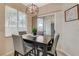 Bright dining area with modern light fixture, and sliding glass door at 9050 W Warm Springs Rd # 1074, Las Vegas, NV 89148