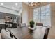 Bright dining space with dark wood table and modern lighting fixture at 9050 W Warm Springs Rd # 1074, Las Vegas, NV 89148