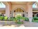 Elegant entrance to the community center featuring lush landscaping and a grand doorway at 9050 W Warm Springs Rd # 1074, Las Vegas, NV 89148