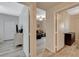 Hallway showcasing open doorway between rooms with light wood flooring throughout the home at 9050 W Warm Springs Rd # 1074, Las Vegas, NV 89148