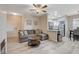 A cozy living room featuring an open layout leading to a modern kitchen with stainless steel appliances at 9050 W Warm Springs Rd # 1074, Las Vegas, NV 89148
