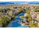 An aerial view of community pools surrounded by lush landscaping and cozy seating areas at 9050 W Warm Springs Rd # 1074, Las Vegas, NV 89148