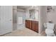Bathroom with a double sink vanity, toilet, and shower and tub combo, providing a functional space at 946 Belton Lake Ave, North Las Vegas, NV 89086