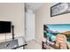 Bedroom showcases a desk area and a mounted TV at 946 Belton Lake Ave, North Las Vegas, NV 89086