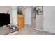 Carpeted bedroom featuring a wooden dresser and two white doors at 946 Belton Lake Ave, North Las Vegas, NV 89086