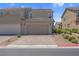 Attractive two-story home boasting a tile roof, inviting curb appeal, and convenient two-car garage at 946 Belton Lake Ave, North Las Vegas, NV 89086