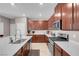 Contemporary kitchen with stainless steel appliances, white countertops, and a convenient island at 946 Belton Lake Ave, North Las Vegas, NV 89086