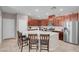 Modern kitchen featuring stainless steel appliances, a large center island, and stylish barstool seating at 946 Belton Lake Ave, North Las Vegas, NV 89086