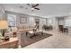 Comfortable living room with tile floors, neutral decor, a ceiling fan and an open floor plan at 946 Belton Lake Ave, North Las Vegas, NV 89086