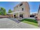 Expansive backyard featuring a covered patio, green space, and a large concrete area for entertaining and recreation at 9656 Paraiso Springs St, Las Vegas, NV 89139