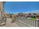 Balcony with wrought-iron railings offering a view of the neighborhood at 9656 Paraiso Springs St, Las Vegas, NV 89139