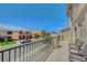 Balcony with wrought-iron railings offering a view of the neighborhood at 9656 Paraiso Springs St, Las Vegas, NV 89139