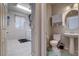Well-lit bathroom and laundry room with vanity and modern fixtures at 9656 Paraiso Springs St, Las Vegas, NV 89139