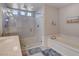 Bright bathroom featuring a large shower with glass door and a soaking tub for relaxation at 9656 Paraiso Springs St, Las Vegas, NV 89139
