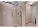 Modern bathroom featuring a clear glass shower and a bright walk-in closet at 9656 Paraiso Springs St, Las Vegas, NV 89139