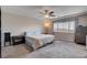 Comfortable bedroom features plush carpeting, ample natural light, and neutral color palette at 9656 Paraiso Springs St, Las Vegas, NV 89139