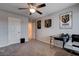 Bedroom featuring neutral carpet, ceiling fan, and a work desk at 9656 Paraiso Springs St, Las Vegas, NV 89139