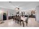 Open concept dining area adjacent to kitchen, bathed in natural light from large windows at 9656 Paraiso Springs St, Las Vegas, NV 89139
