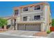Beautiful two-story home features a balcony, two-car garage, and well-manicured landscaping, creating a welcoming exterior at 9656 Paraiso Springs St, Las Vegas, NV 89139