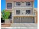Elegant two-story home with a covered balcony and two-car garage offers curb appeal and modern amenities at 9656 Paraiso Springs St, Las Vegas, NV 89139