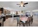 Open kitchen and dining area, perfect for entertaining, features stainless appliances and island seating at 9656 Paraiso Springs St, Las Vegas, NV 89139