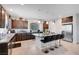 Spacious kitchen with granite countertops, a central island with seating, and stainless steel appliances at 9656 Paraiso Springs St, Las Vegas, NV 89139
