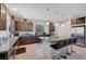 Spacious kitchen features granite counters, a center island with seating, and stainless steel appliances at 9656 Paraiso Springs St, Las Vegas, NV 89139