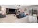 Large living room features plush seating, entertainment center, and sliding doors to the backyard at 9656 Paraiso Springs St, Las Vegas, NV 89139