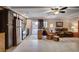 Open living area with kitchen, dining area, and access to the backyard pool at 9656 Paraiso Springs St, Las Vegas, NV 89139
