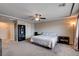 Spacious main bedroom featuring neutral walls, plush carpet, and a ceiling fan for added comfort at 9656 Paraiso Springs St, Las Vegas, NV 89139